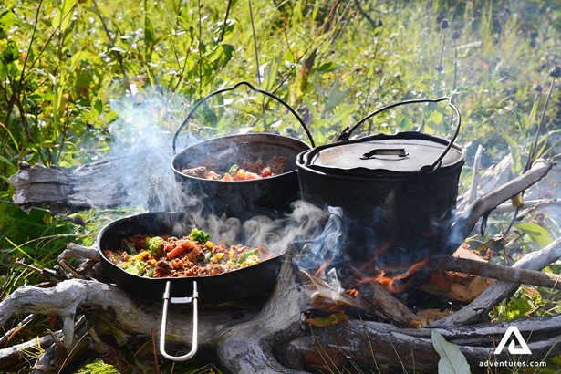 cooking food on a campfire stove in sweden