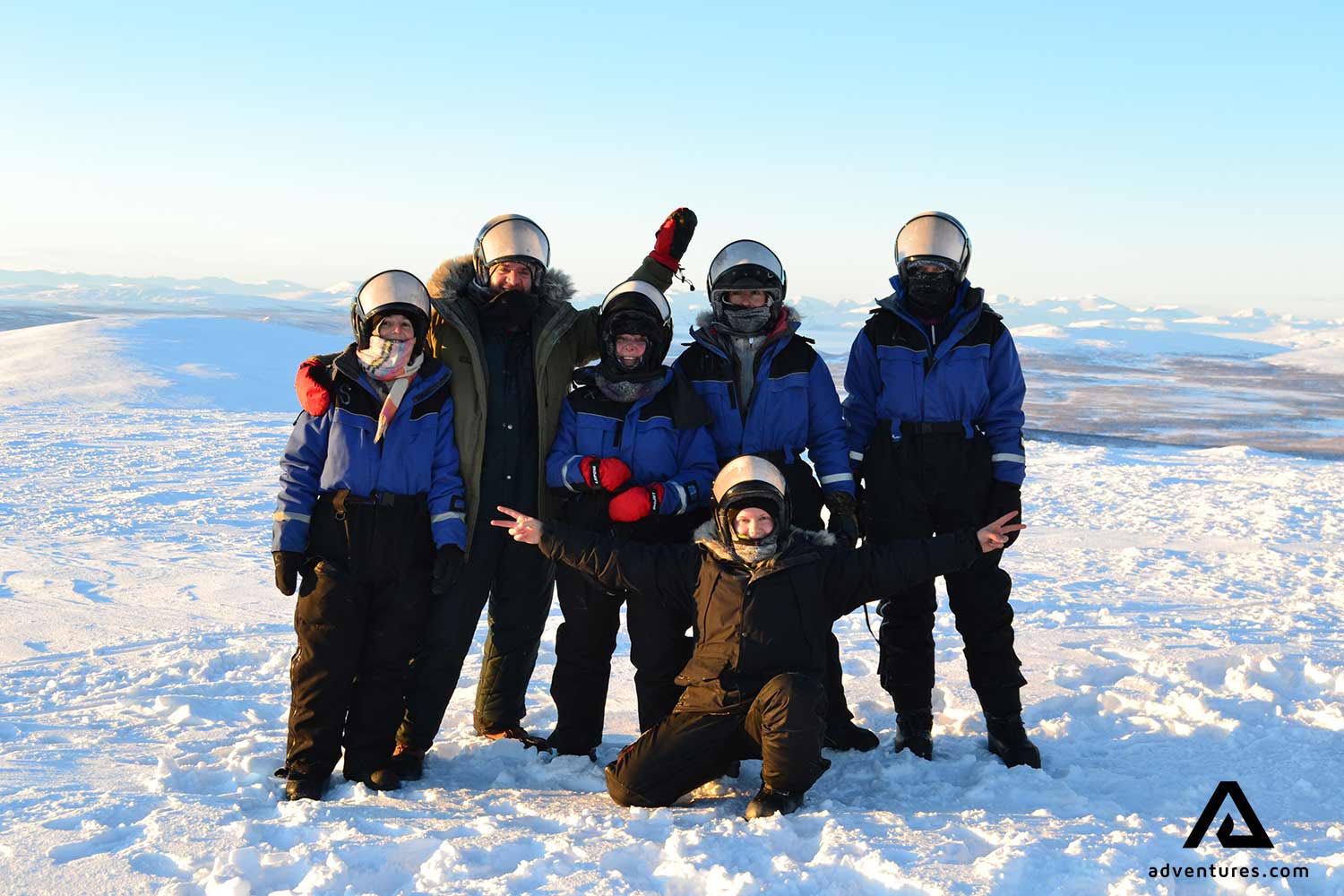 group posing for a picture in sweden in winter