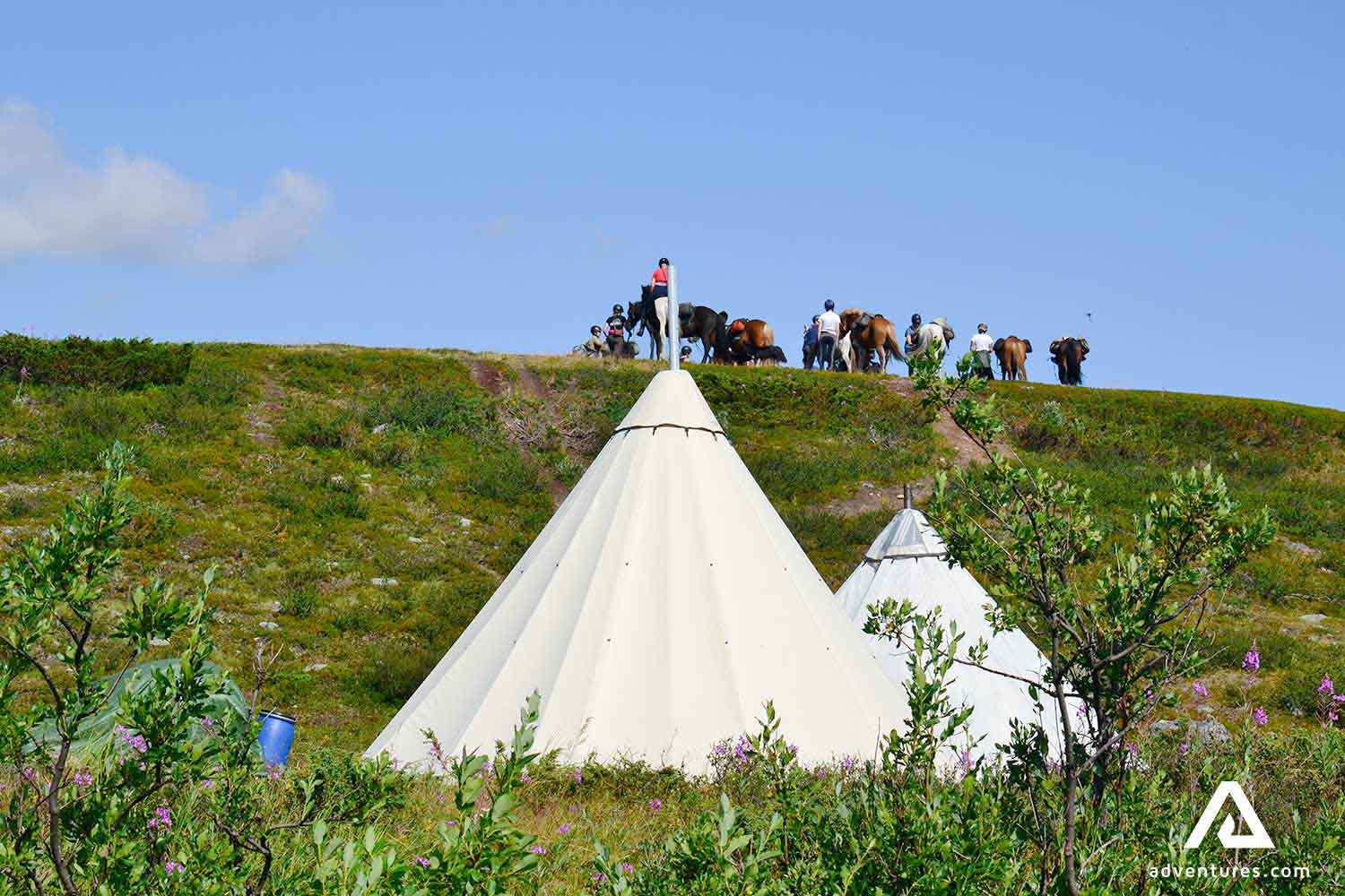 horse riding near teepees in ratekjokk trail