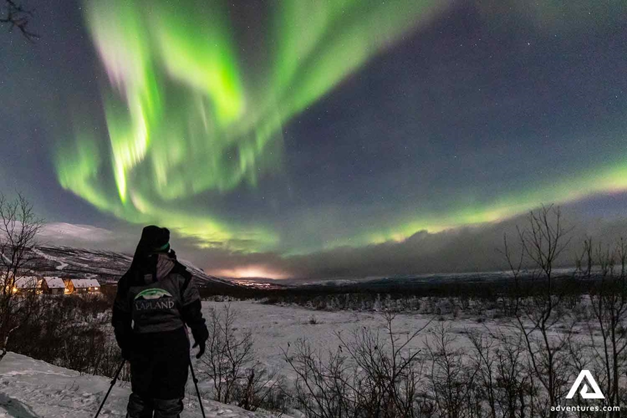 photographer watching northern lights