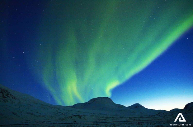 aurora borealis in the blue night sky in sweden lapland