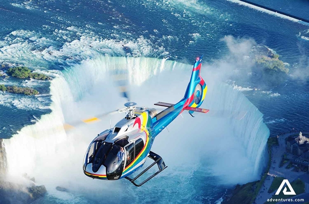 helicopter flying over niagara falls in canada