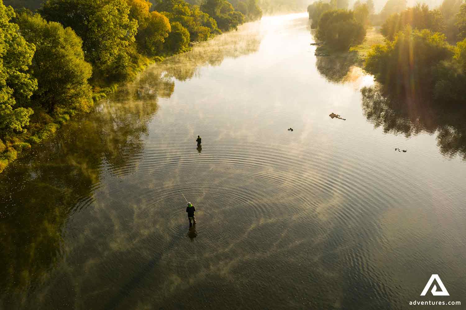 fishers at freshwater river in canada