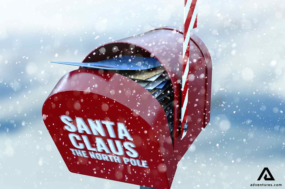 snowy santa claus marked mailbox