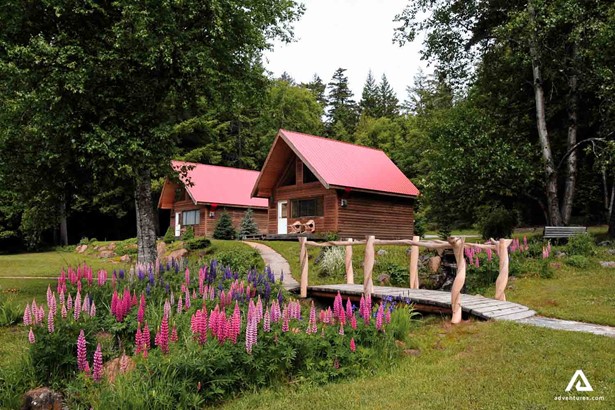 Summer vacation lodges with bridge and flowers around