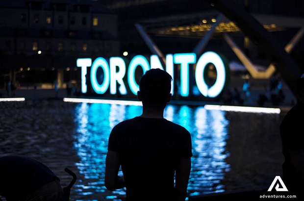 silhoutte of a person near night lights in canada