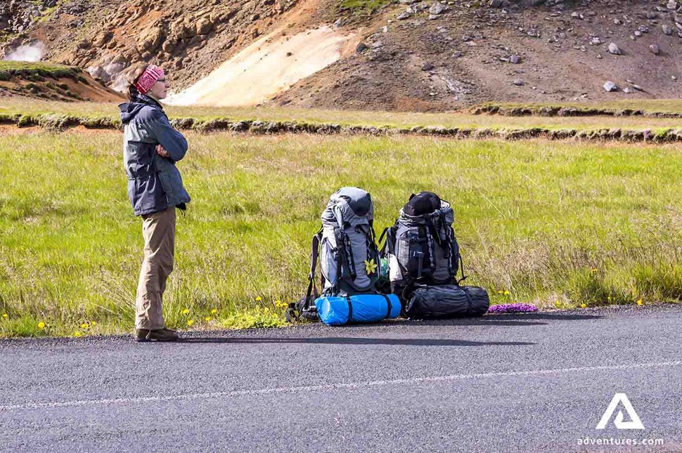 woman hitchhiking backpacking in iceland