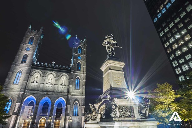 statue and notre dame basilica in montreal