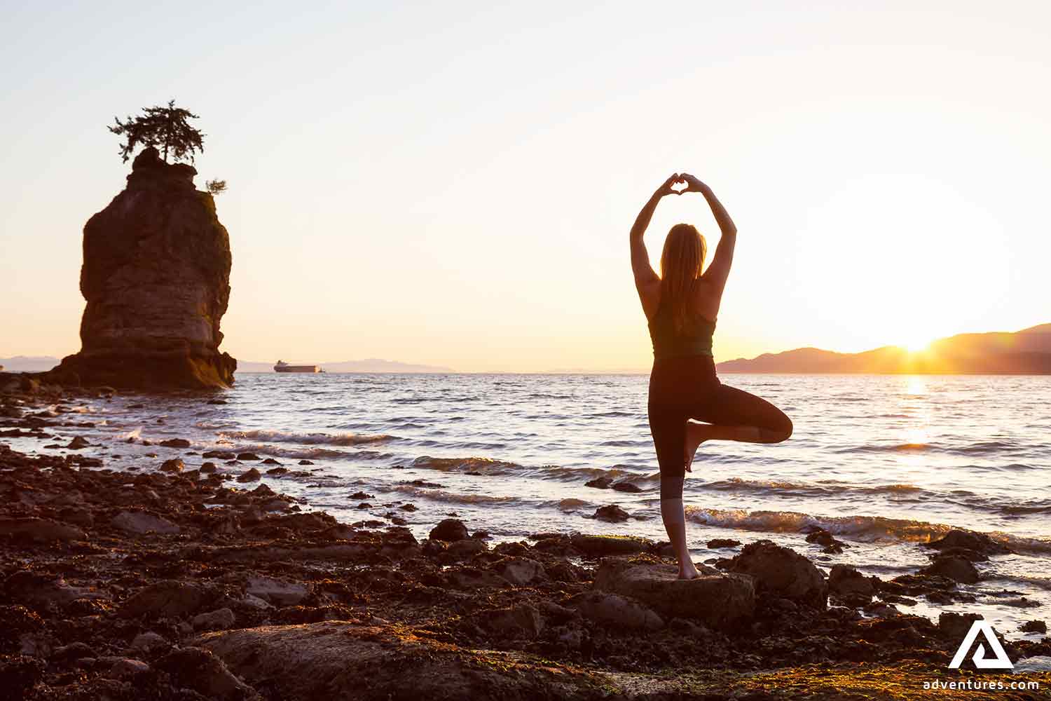 meditating and doing yoga at a beach on sunset