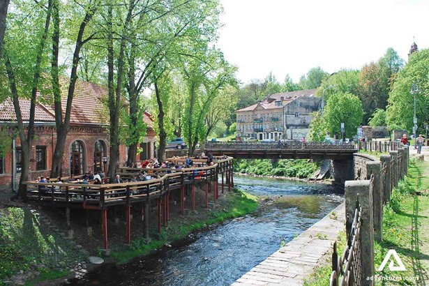 uzupis district river and small bridge in vilnius
