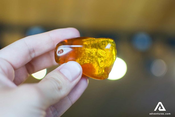 large piece of amber in hand 
