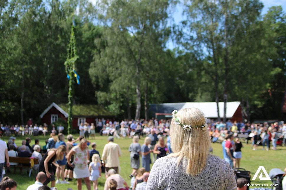 swedish locals celebrating midsummer festival