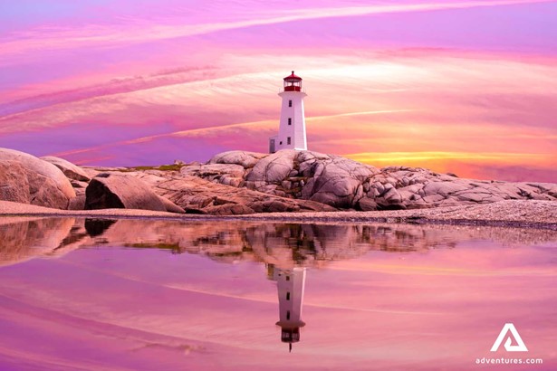 bright sunset at Peggy Cove Lighthouse in canada in summer