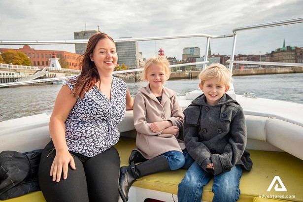 children with a mother in a sightseeing boat