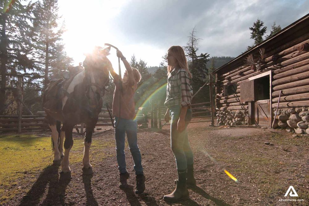 Preparing for horseback riding in a ranch