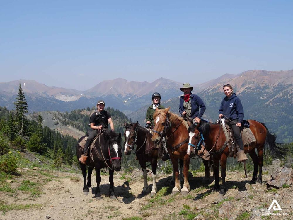A group of people on a horse ride tour