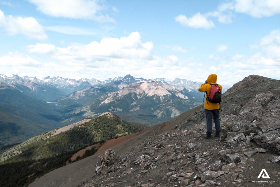 hiker looking at mountain range