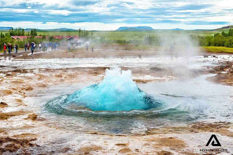 the beginning of geysir erupting in iceland