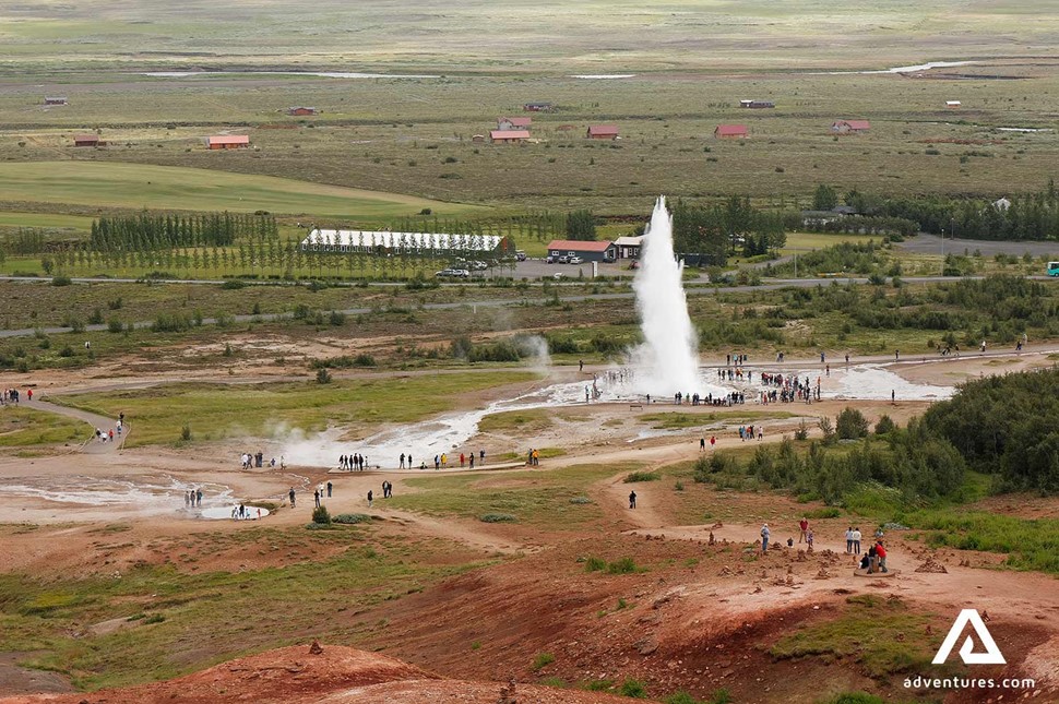 aerial drone view of geysir eruptin