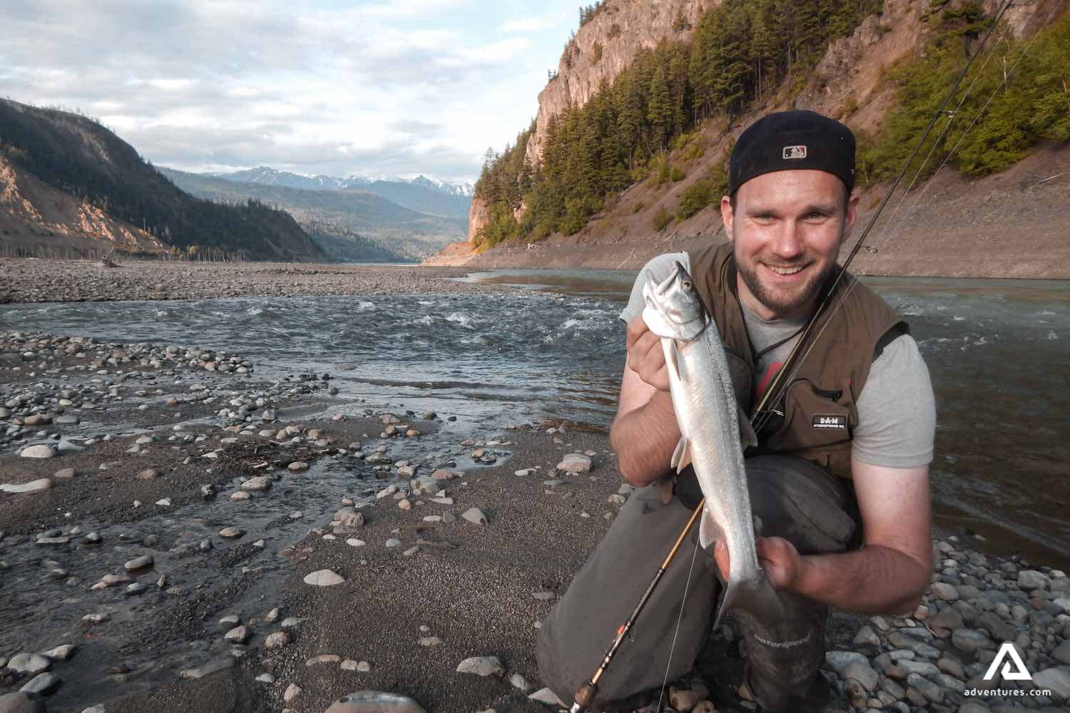 Man shows off his fish catch