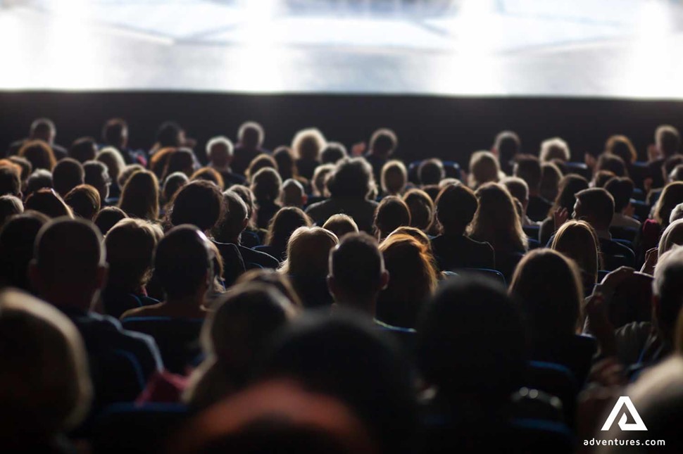 audience watching a film in a movie theatre