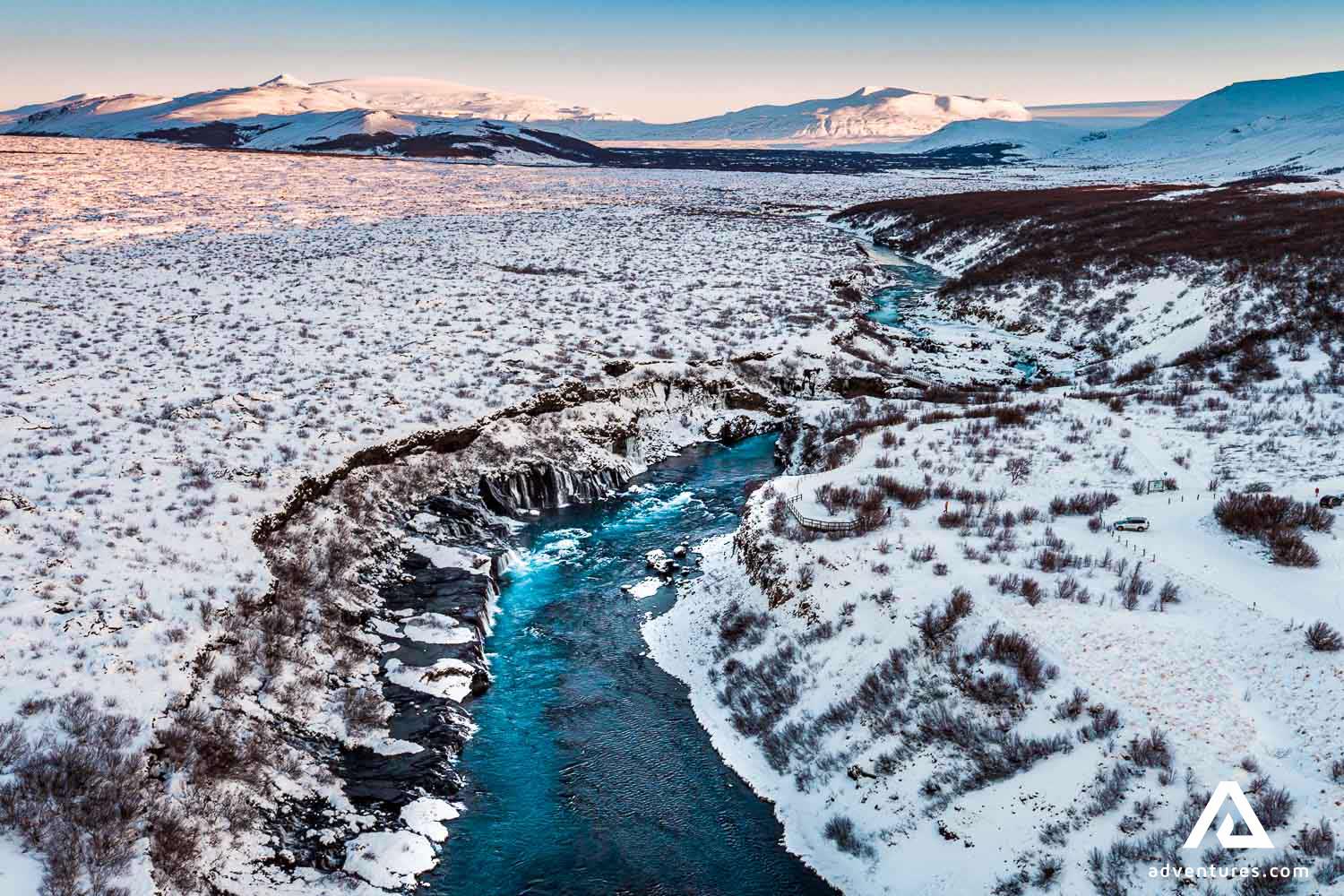 hraunfossar waterfall in winter in iceland