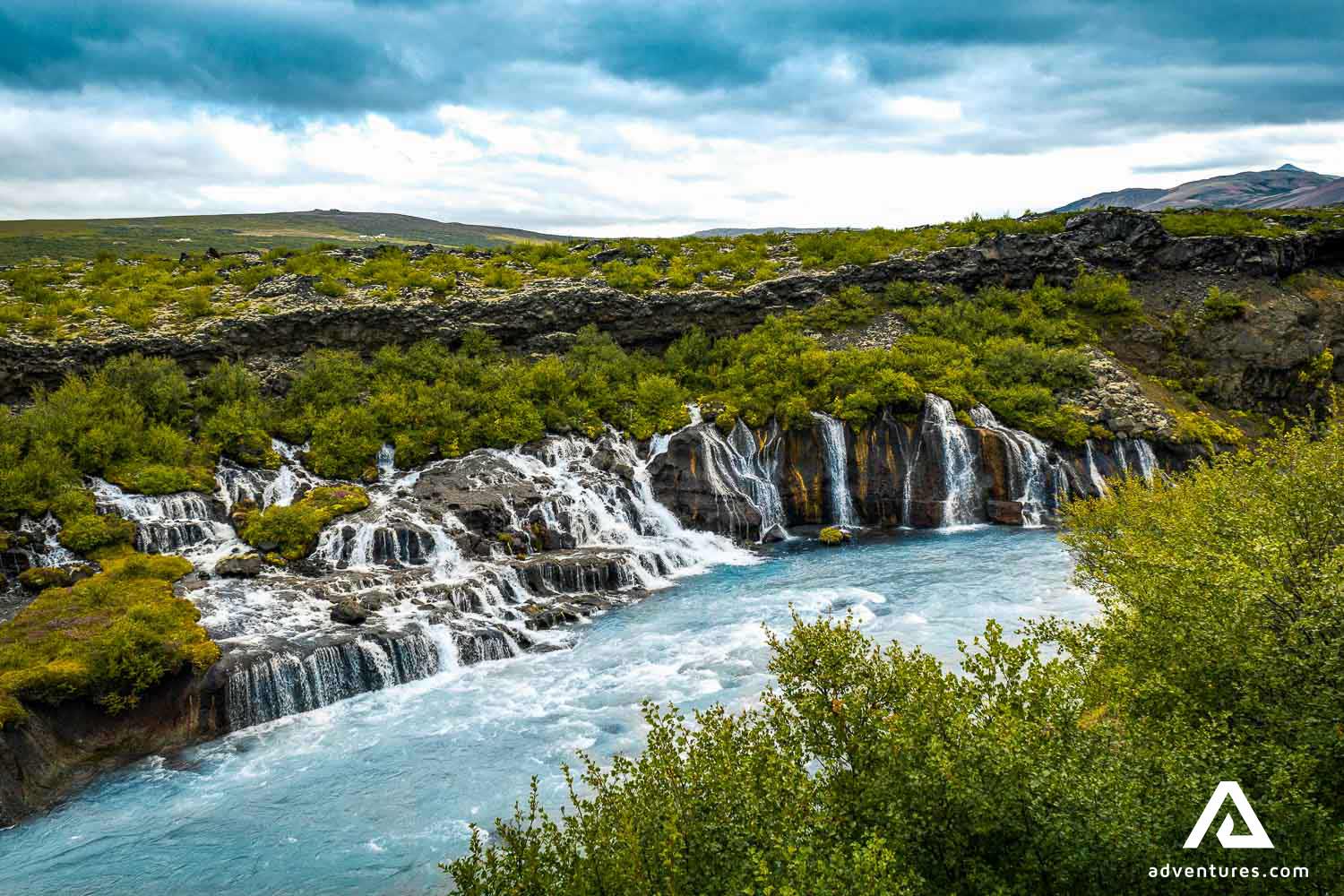 view of hraunfossar waterfall in summer