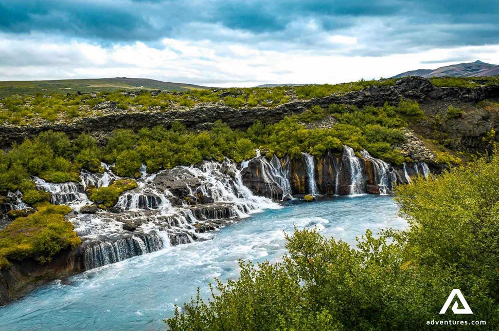 view of hraunfossar waterfall in summer