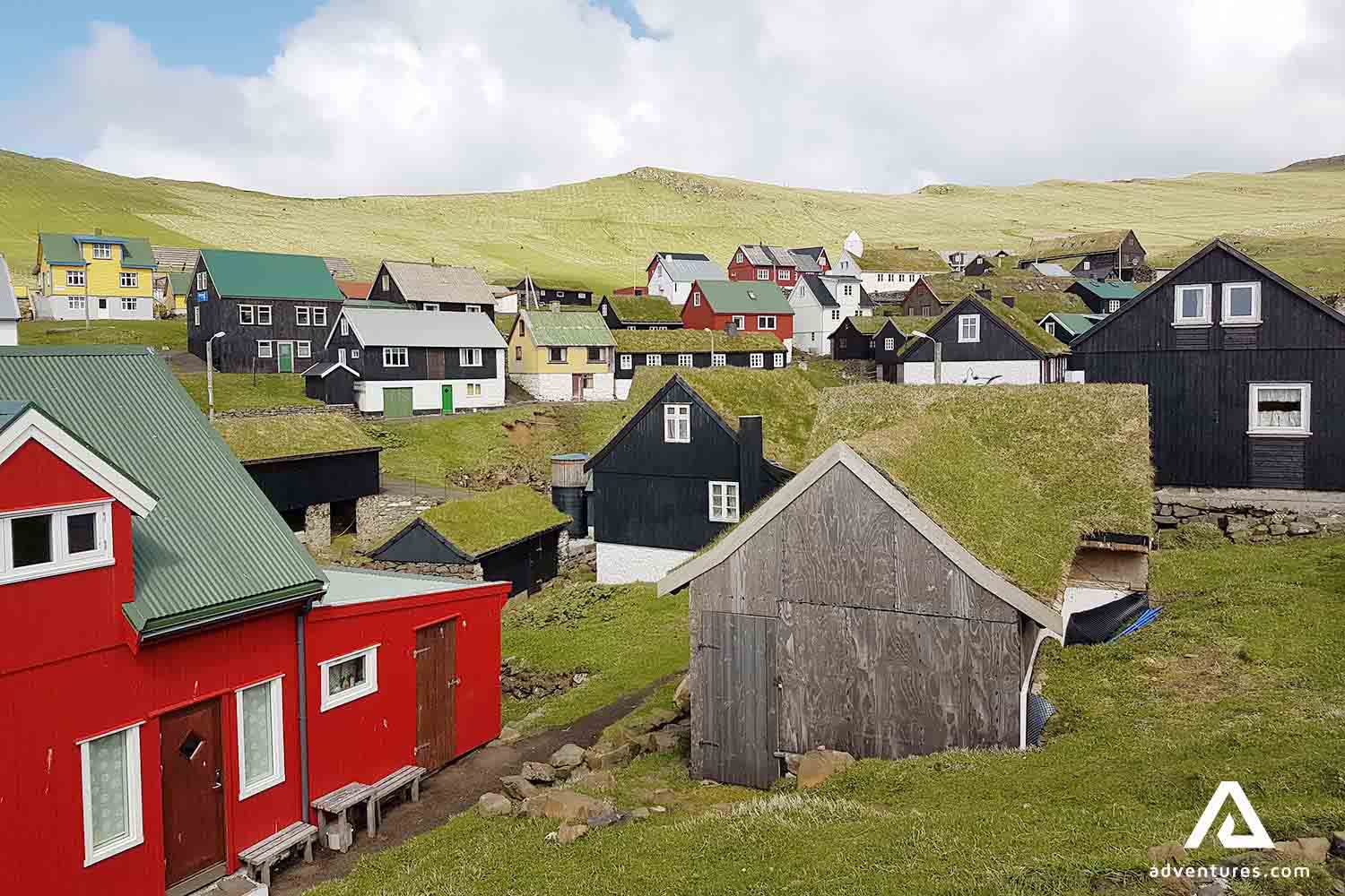 colorful turf houses in mykines village in faroe islands