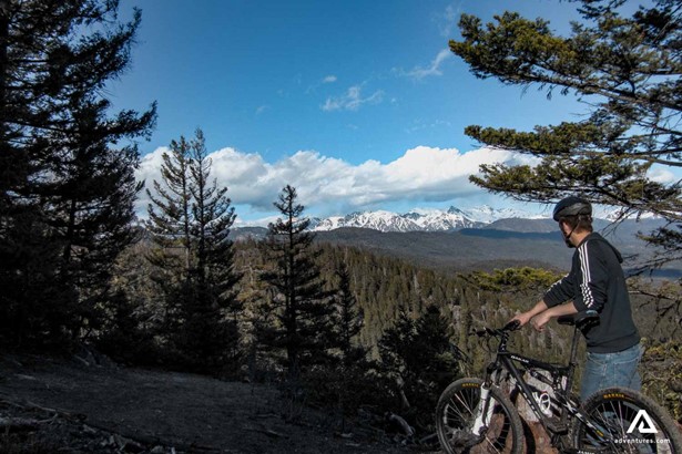 Man on a bike tour in mountains