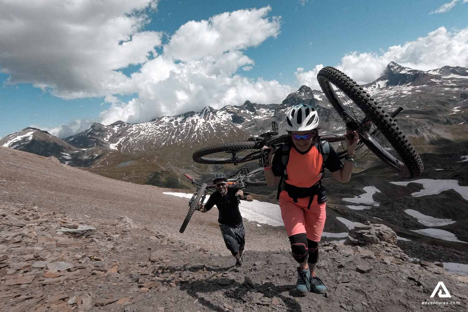 Cyclers carry along bike