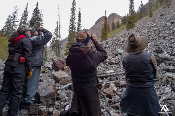 Tourists watching wildlife through binoculars