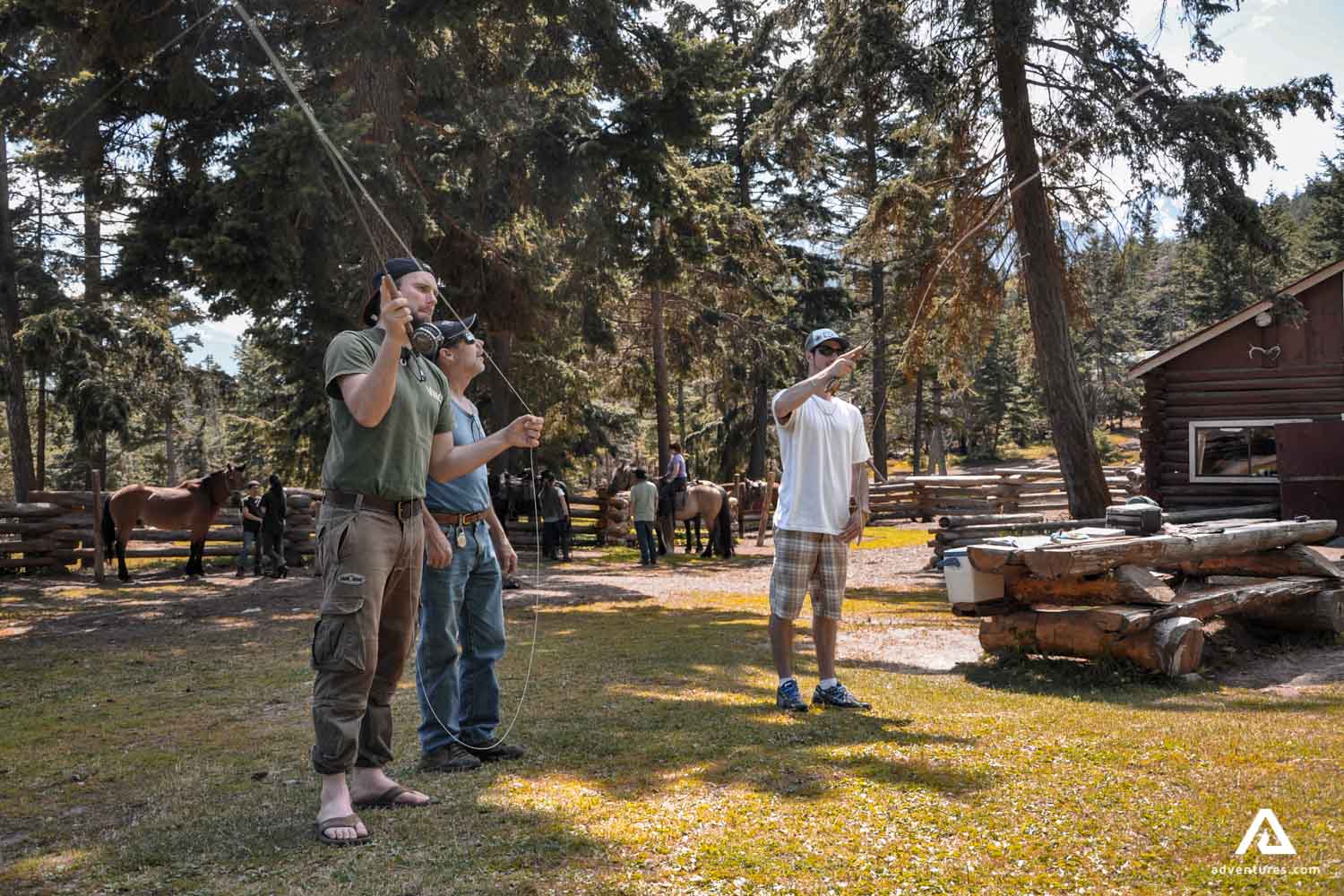 Men learning fly fishing technique