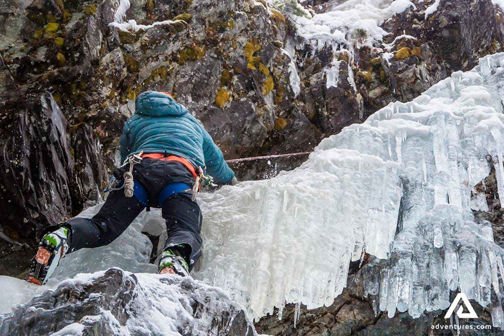 climbing a steep frozen waterfall