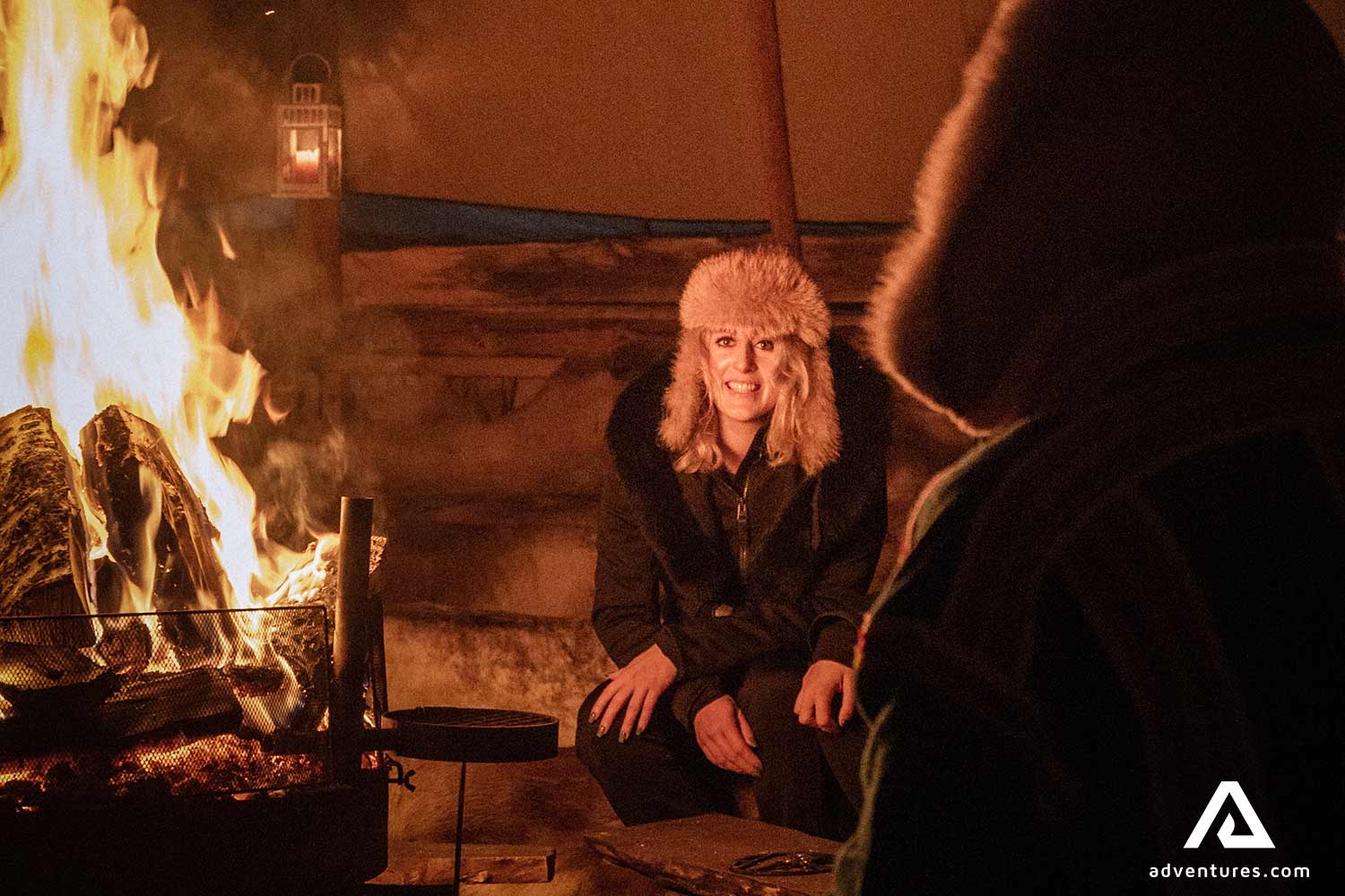 warming up near a campfire in norway