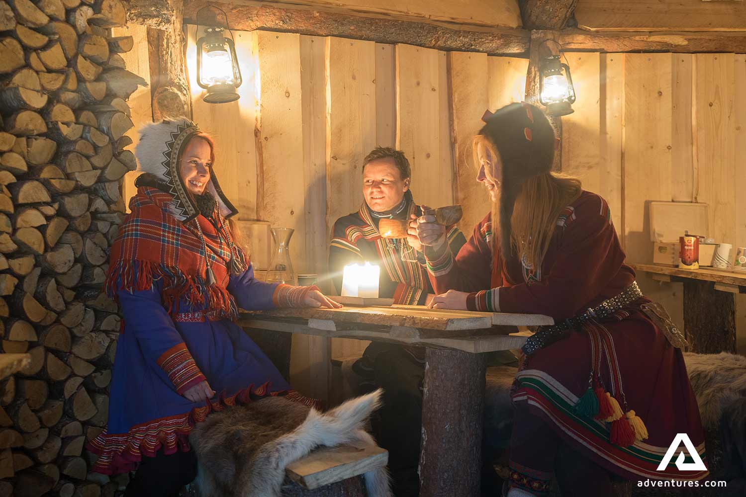 dressed up people having dinner in a cabin