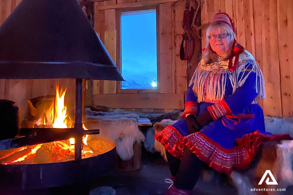 sami culture woman warming up
