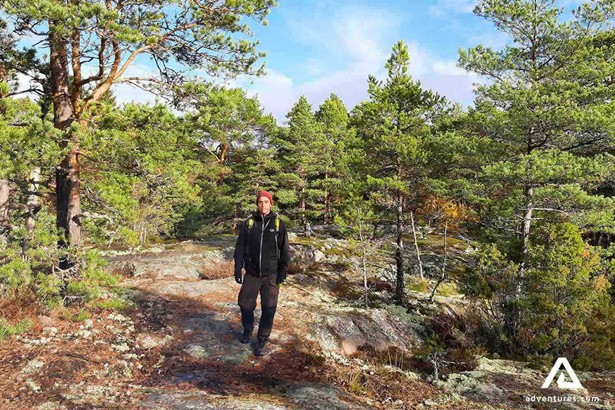 man hiking in the porkkala forest area in finland