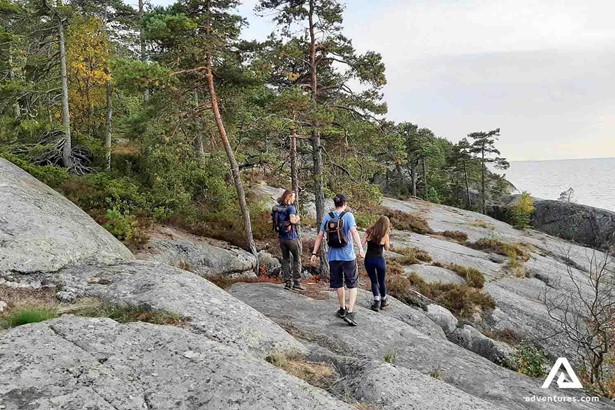 friends hiking near porkkala area coastline