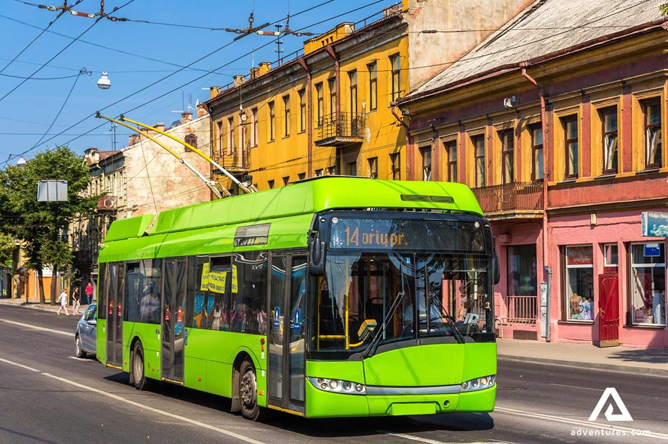 a green trolleybus driving in kaunas city lithuania