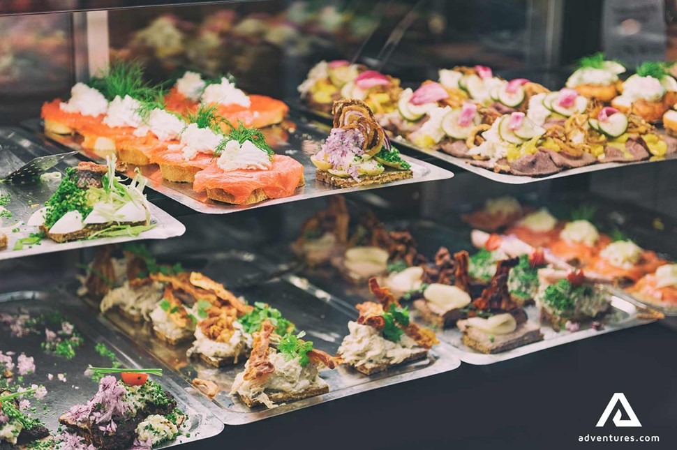 two shelves with variety of appetisers and entrees