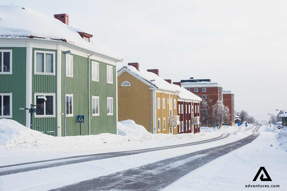 snowy street and building in kiruna town in sweden
