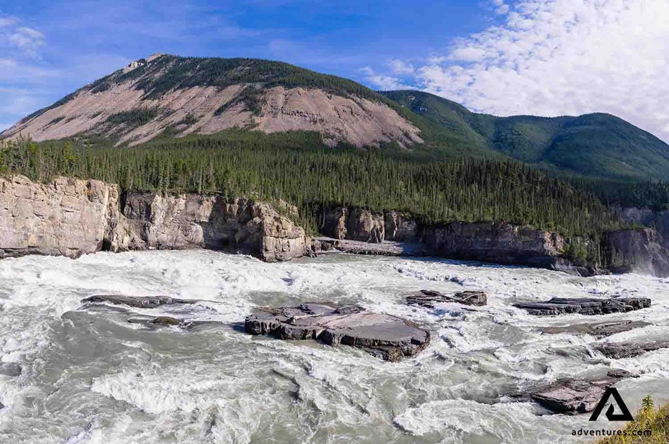 powerful stream of water at nahanni river in canadian northwest
