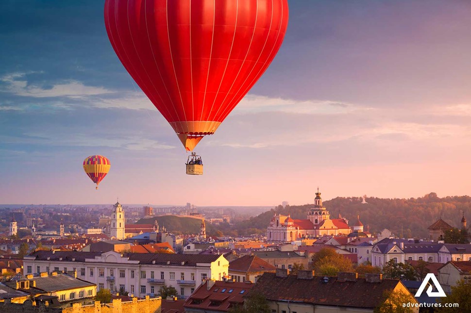 hot air balloons at sunset above vilnius city in summer