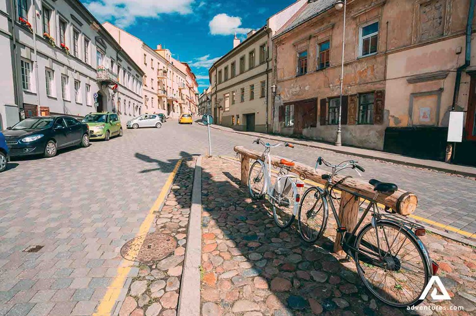 bikes and cars parked in uzupis district in vilnius