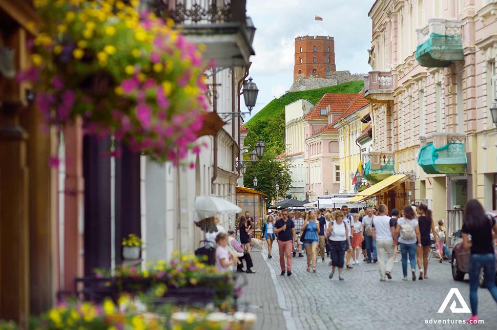people walking down vilnius old town streets in summer