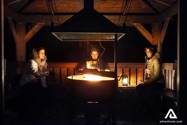 friends near a campfire in finland