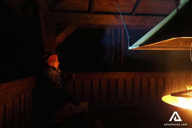woman near a campfire in finland