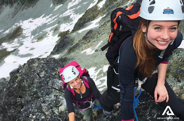happy women rock climbers at blackcomb mountains