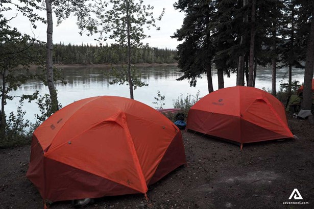 Camping Tents On River Bank